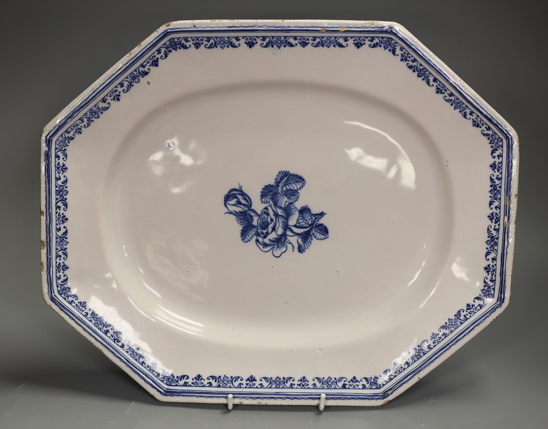 A French faience canted rectangular blue and white serving dish, probably Rouen, second quarter 18th century, 38cm